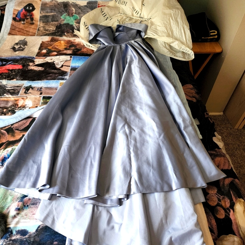A blue silky dress with an off the shoulder design great for anything.